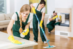 house cleaners cleaning a large room
